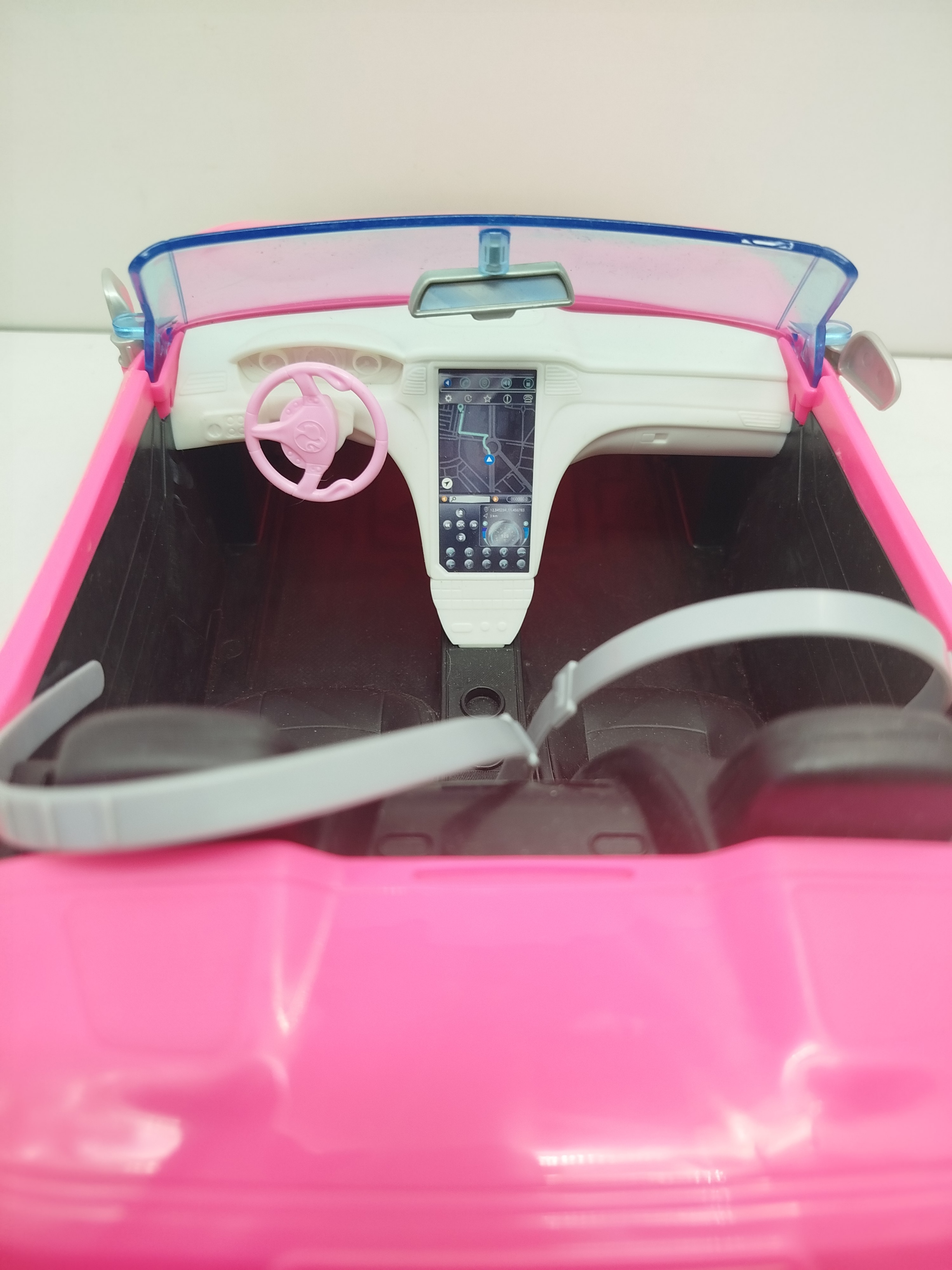 Barbie  - Vehículo descapotable color Rosa brillante. Con cinturones de seguridad.