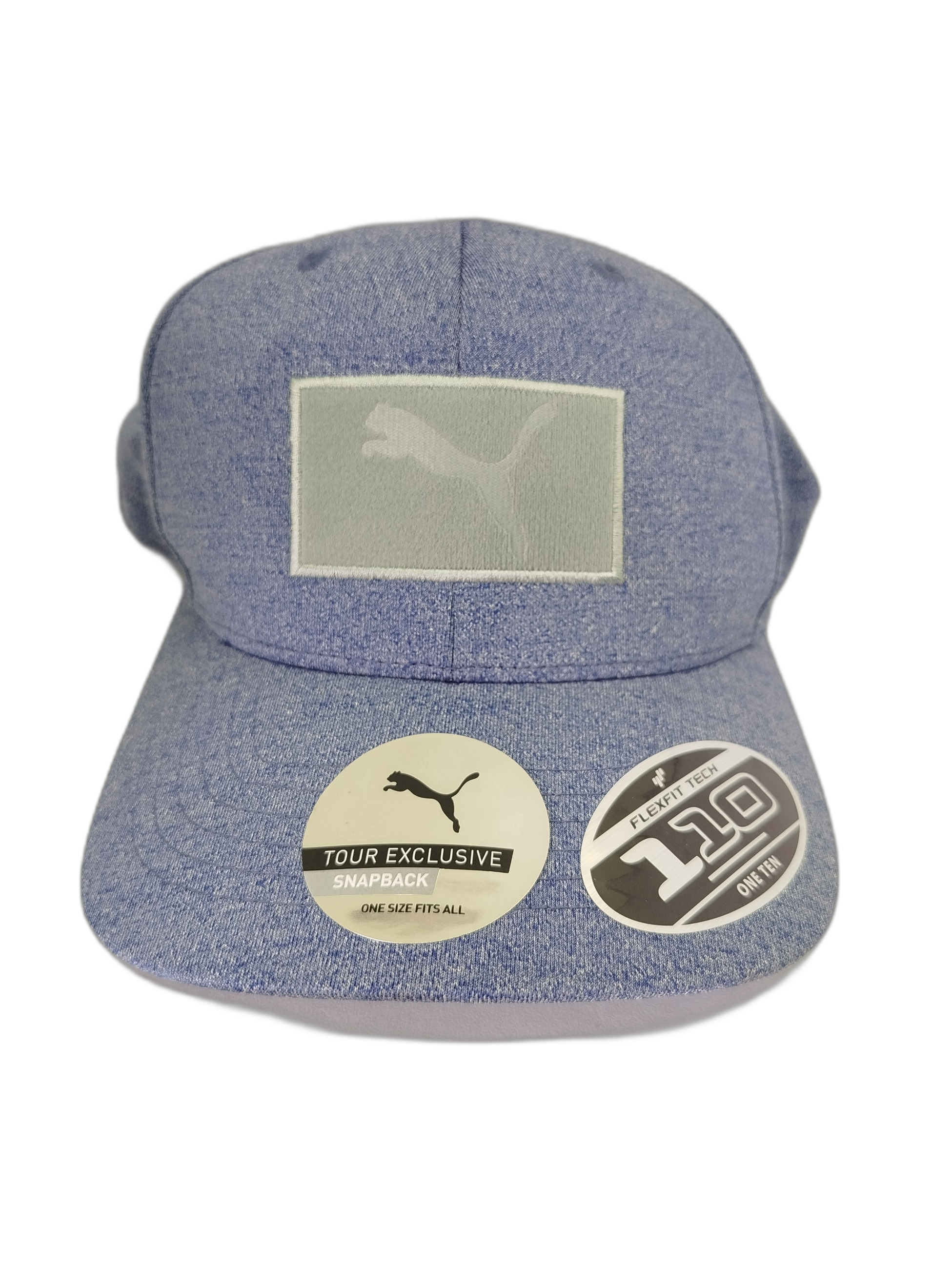 Gorra PUMA Gof Utility Patch 110 Snapback en color azul melange. Incluye parches intercambiables. Teconología Flexfit 110 para ajuste cómodo y ajustable