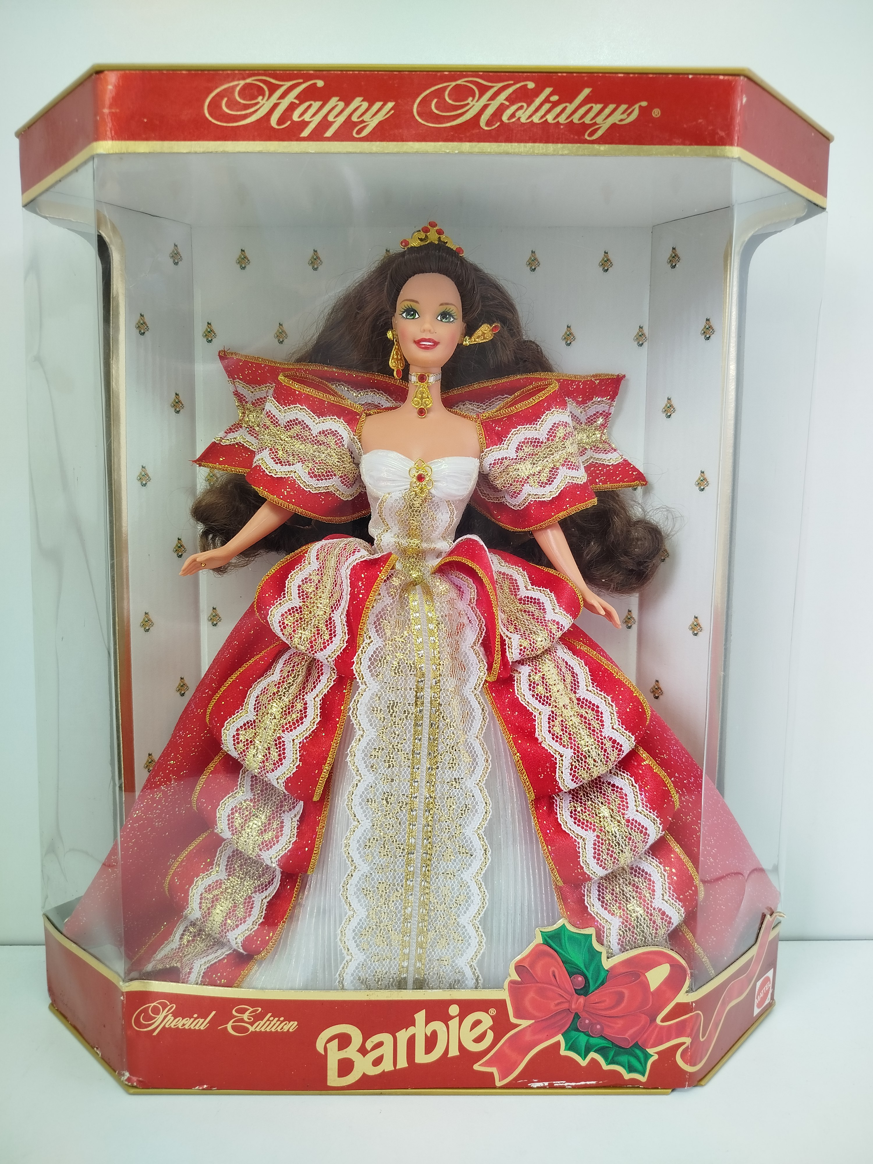  1997 Happy Holidays Barbie Brunette (Edición Especial / Modelo 17832) de Mattel, lanzada para conmemorar el décimo aniversario de la colección navideña.