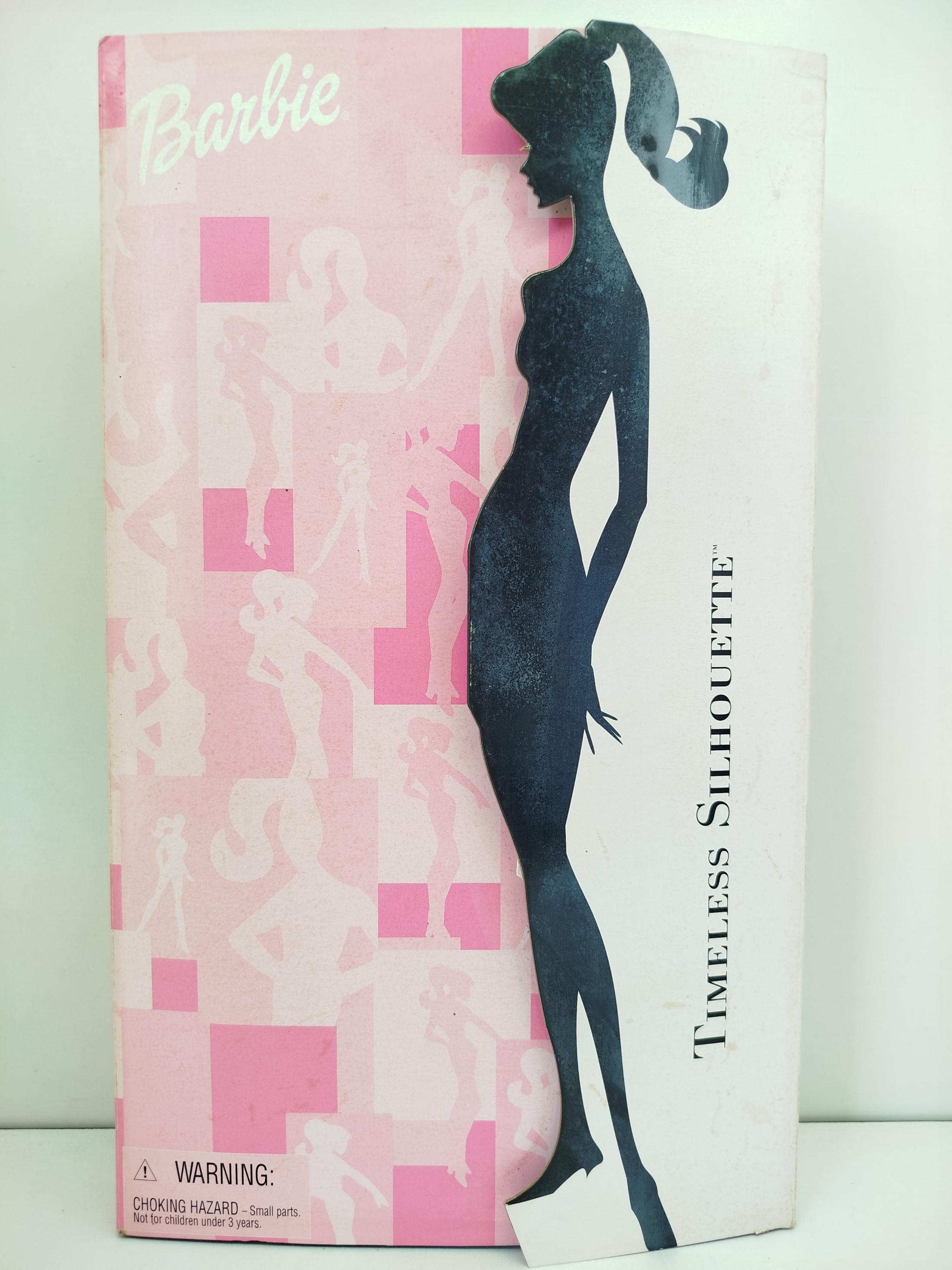 Barbie Timeless Silhouette - Collector Edition (Modelo 29050), lanzada por Mattel en el año 2000 como un elegante homenaje a las siluetas clásicas e históricas de los vestidos de la marca