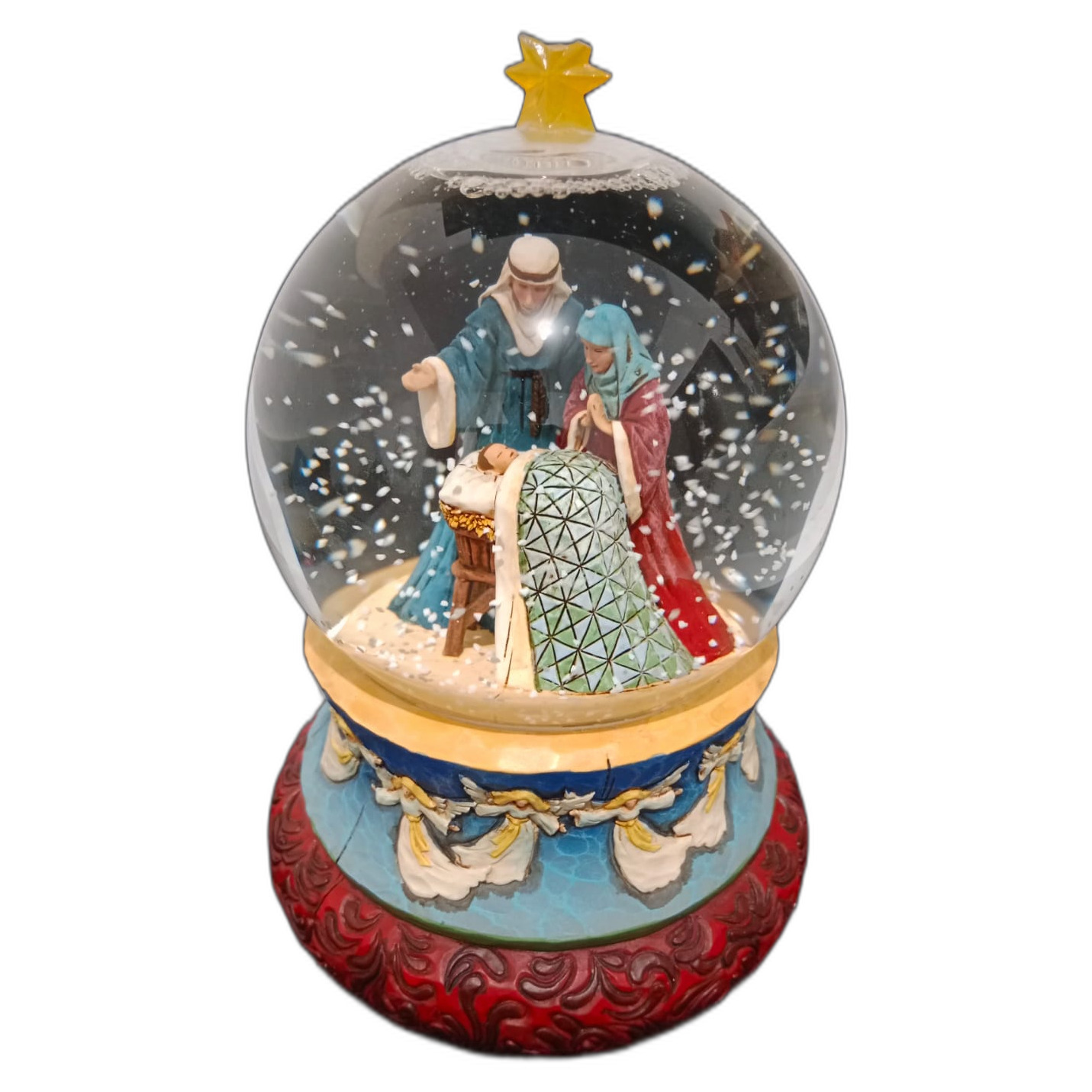 Globo de nieve musical decorativo con un belén en representación de la Sagrada Familia. 