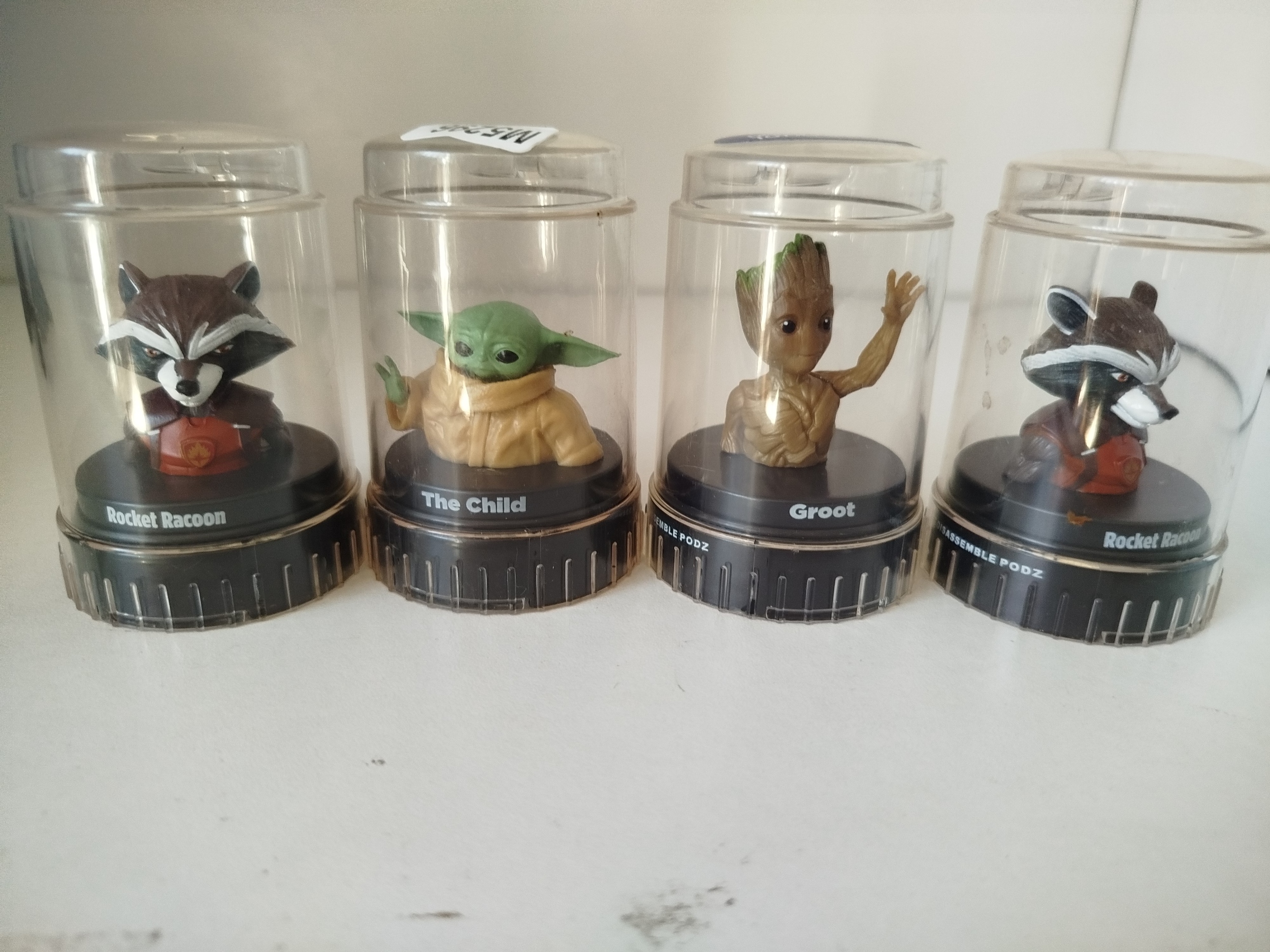 4 PODZ - Jurassic Park - Cápsulas  transparentes con base negra